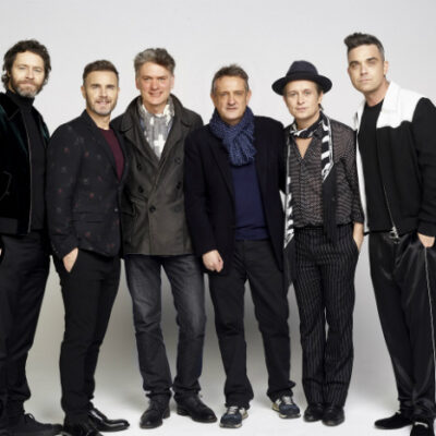 image of Howard Donald, Gary Barlow, Dafydd Rogers, David Pugh, Mark Owen and Robbie Williams. image credit Jay Brooks