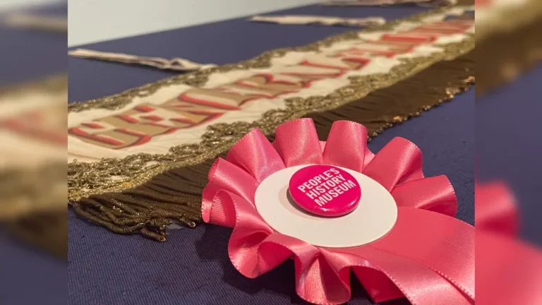 promotional image of a rosette and election poster advertising General Election Trail at People's History Museum Manchester