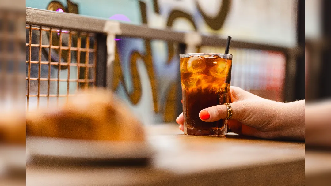 promotional image for 200 Degrees Coffee Shop featuring ice-tea drink
