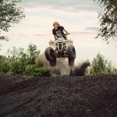 promotional image of Hana Lili riding a quad bike for Bedroom Floor