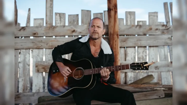 image of Kip Moore playing guitar. promotional image courtesy PJ Brown