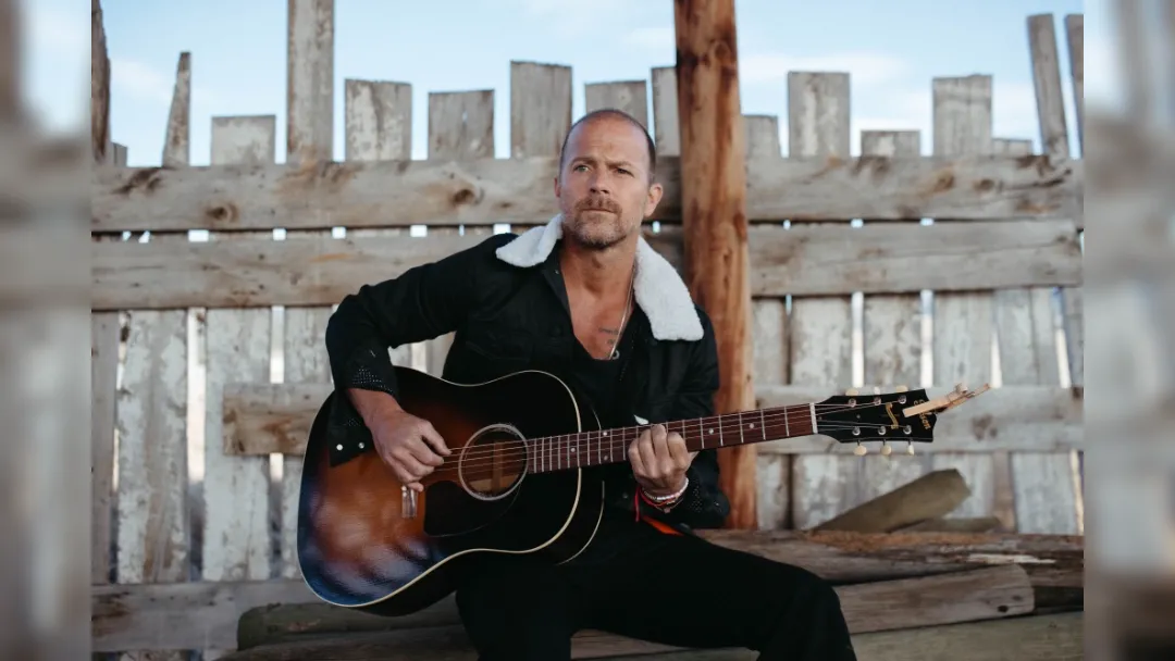 image of Kip Moore playing guitar. promotional image courtesy PJ Brown