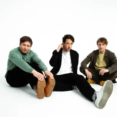 promotional image of The Wombats for new album Oh! The Ocean. image courtesy Julia Godfrey