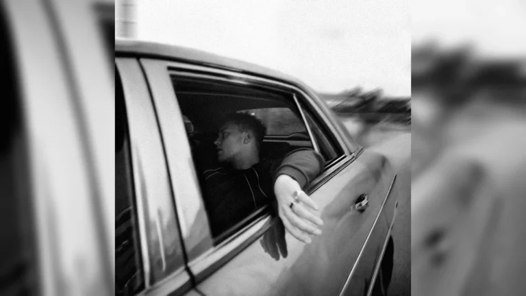 image of Sam Fender sat in a moving car