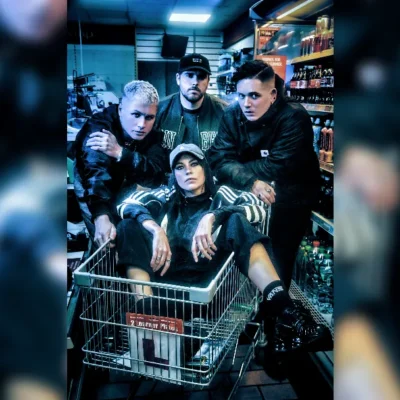 image of Hot Milk band sat in a shopping trolley. image courtesy Greta Kalva
