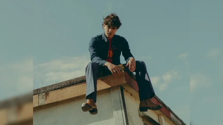 image of Bradley Simpson sat on a rooftop