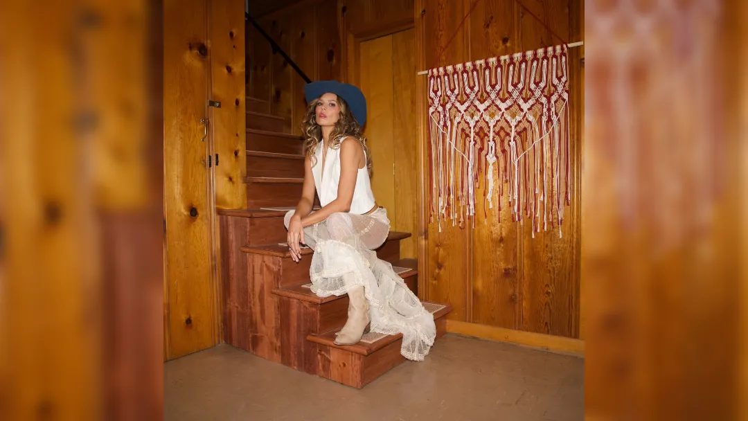 promotional image of Twinnie sat on stairs
