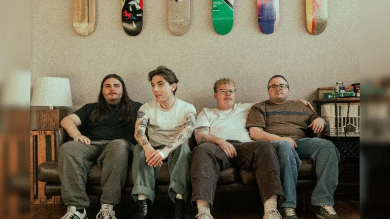 promotional image of Arm's Length sat on a couch. image courtesy Tessa Smith