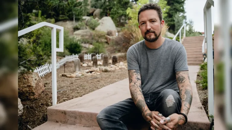 image of Frank Turner sat on stone steps - image courtesy Shannon Shumaker