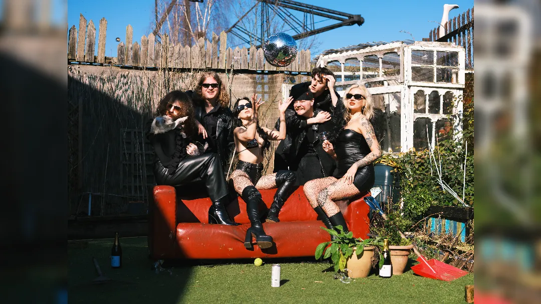promotional image of Jools sat on a couch in a garden. image courtesy Matt Chapman