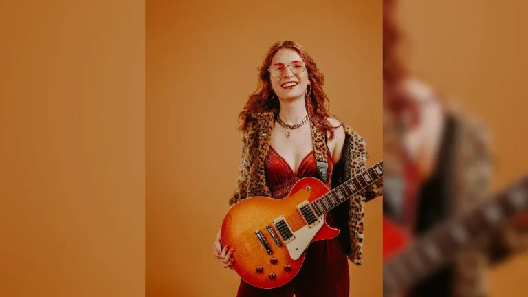 image of Leonie Jakobi stood with guitar. image courtesy Izzy Rubin-Burnett